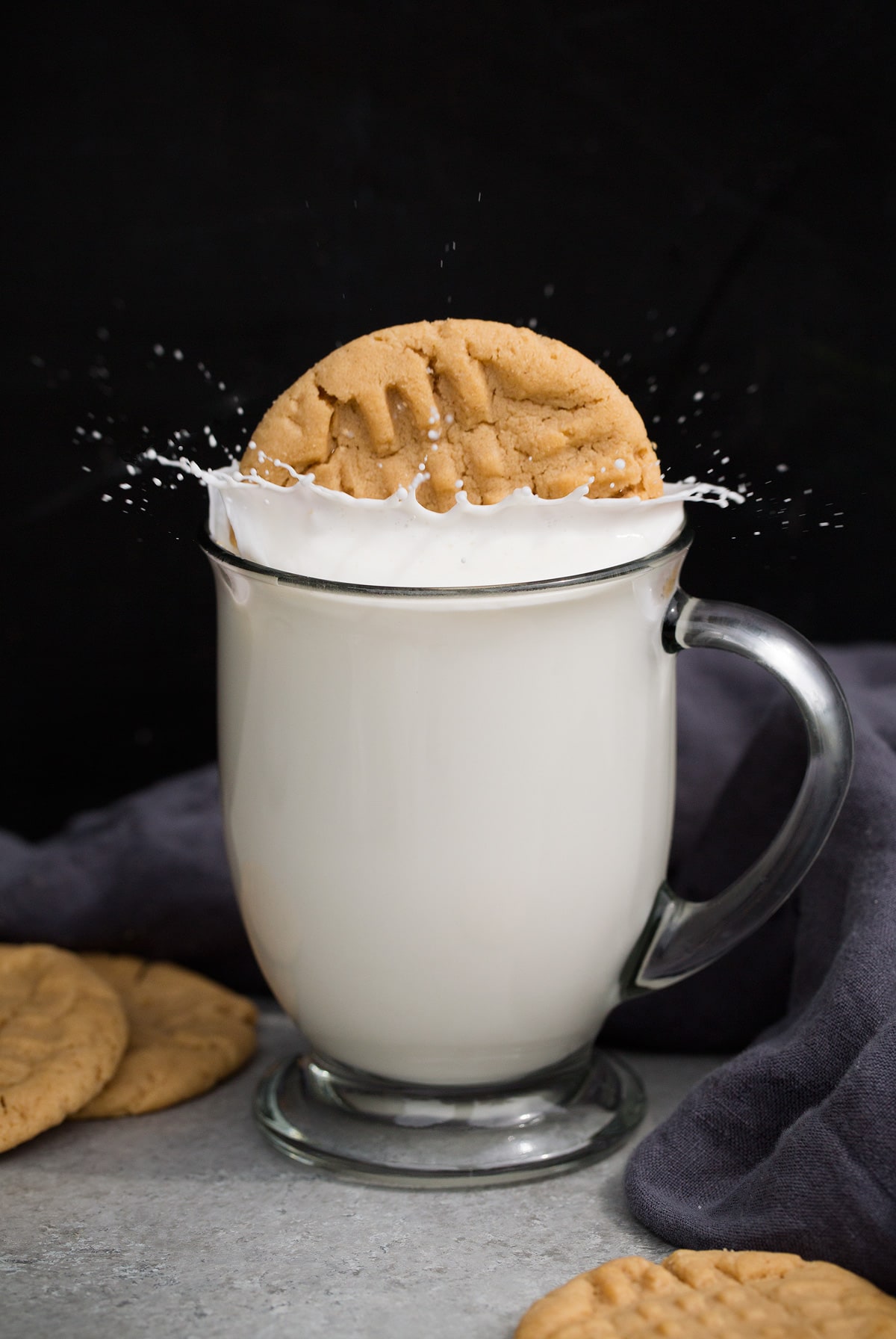 Peanut Butter Cookies dropped in milk and splashing.